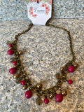 Petra-Cute short necklace, with pink and transparent beads and its chain is brass or dark gold