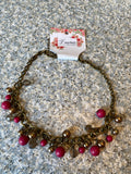 Petra-Cute short necklace, with pink and transparent beads and its chain is brass or dark gold